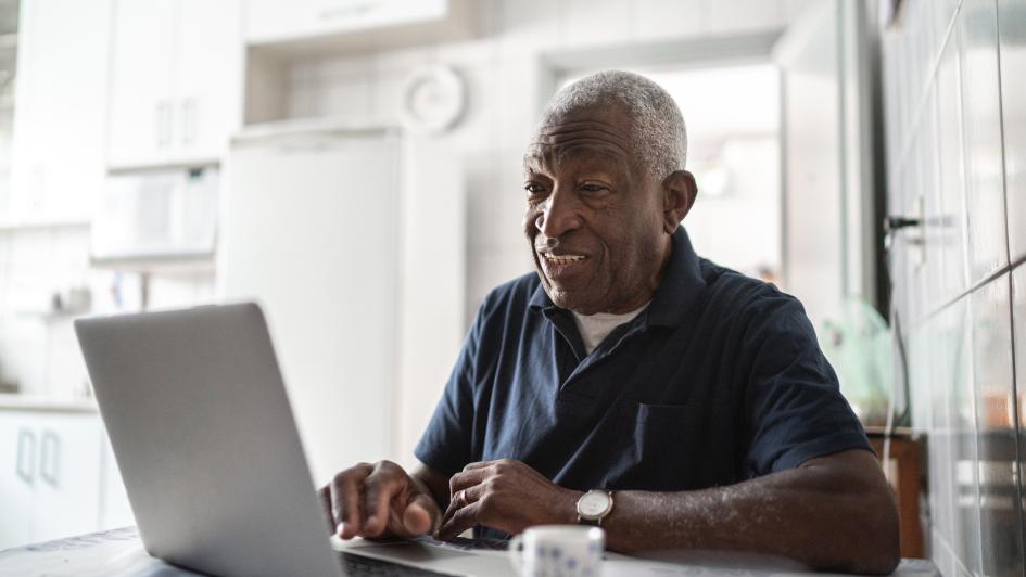 elderly man on laptop